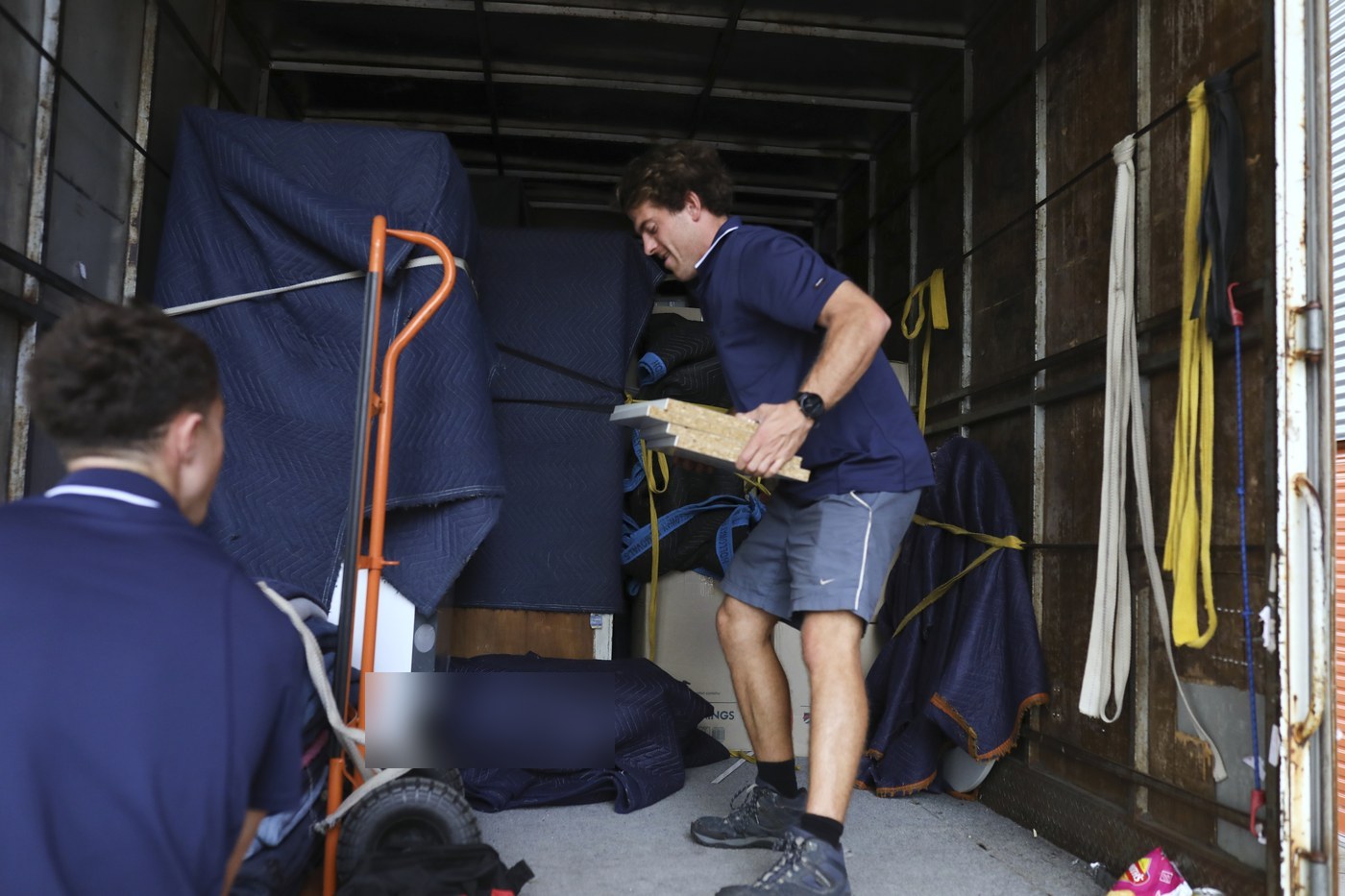 Billy carrying items in the truck