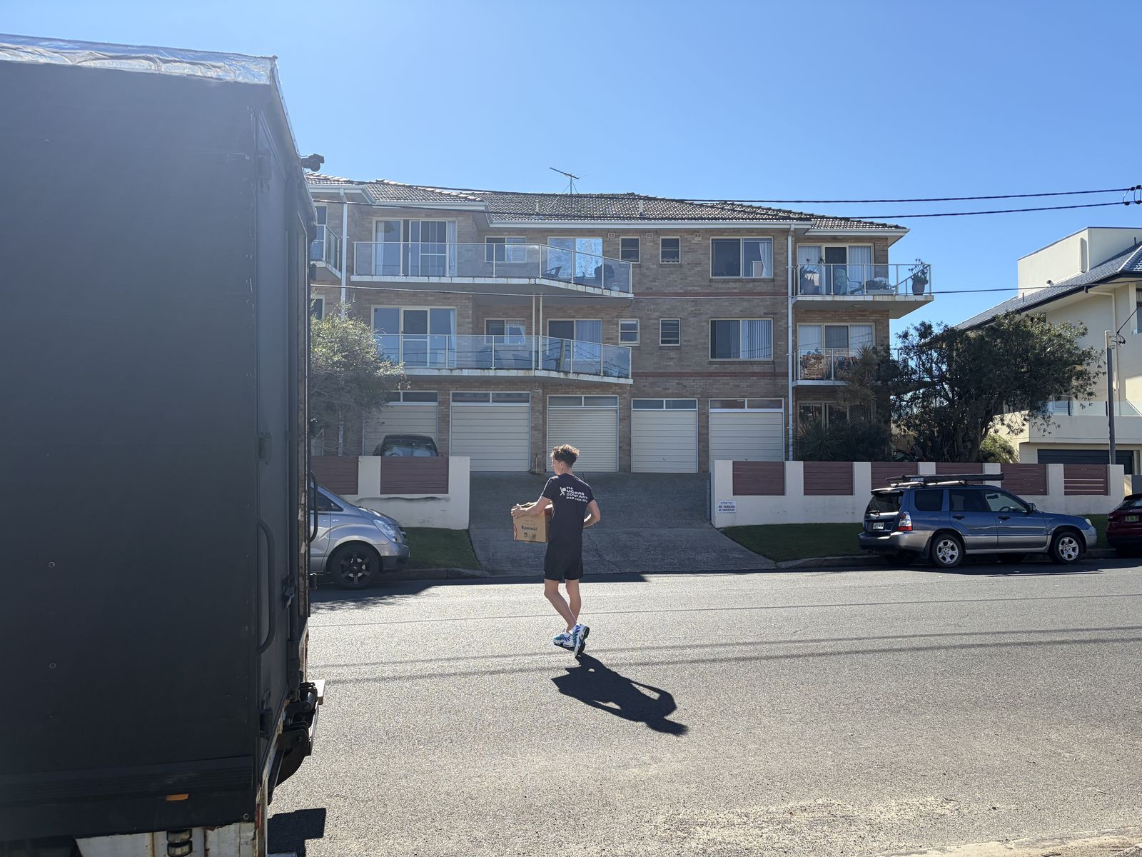 Jet carrying a box across the street to the truck
