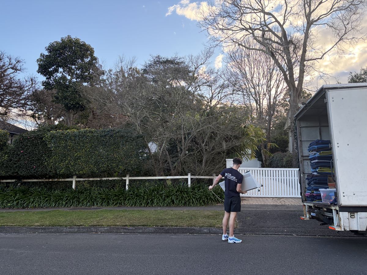 Jet carrying a household item outside a house in Belrose, Sydney
