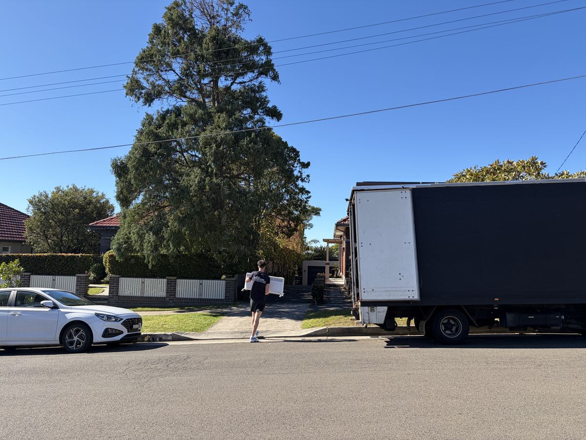 Jet carrying a box outside a house in Chatswood, Sydney