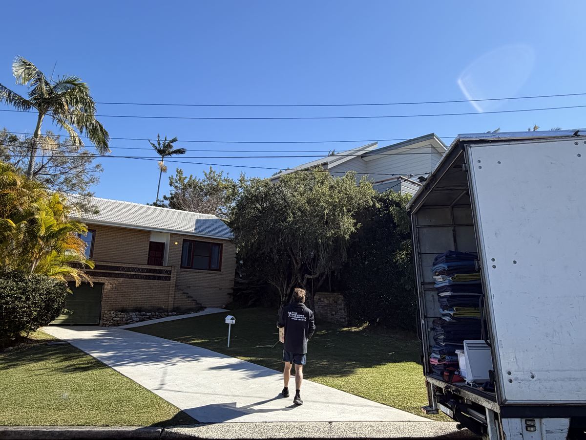 Jet walking towards a house on a Dee Why house move