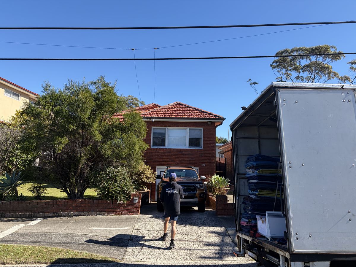 Billy walking up a driveway on a Frenchs Forest house move