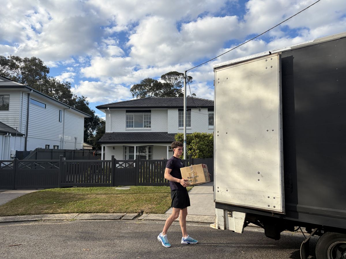Jet carrying a moving box outside a house in Hornsby, Sydney