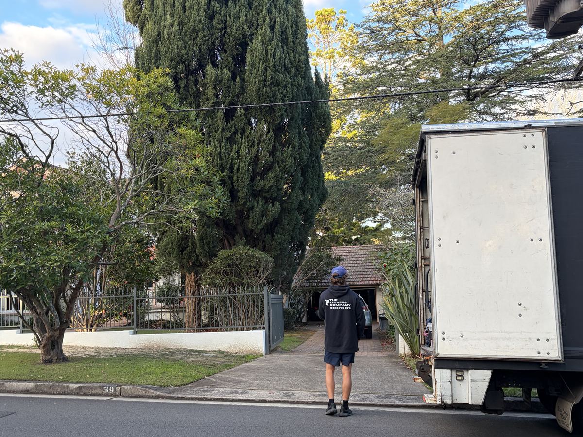 Billy walking towards a house on a Hunters Hill house move