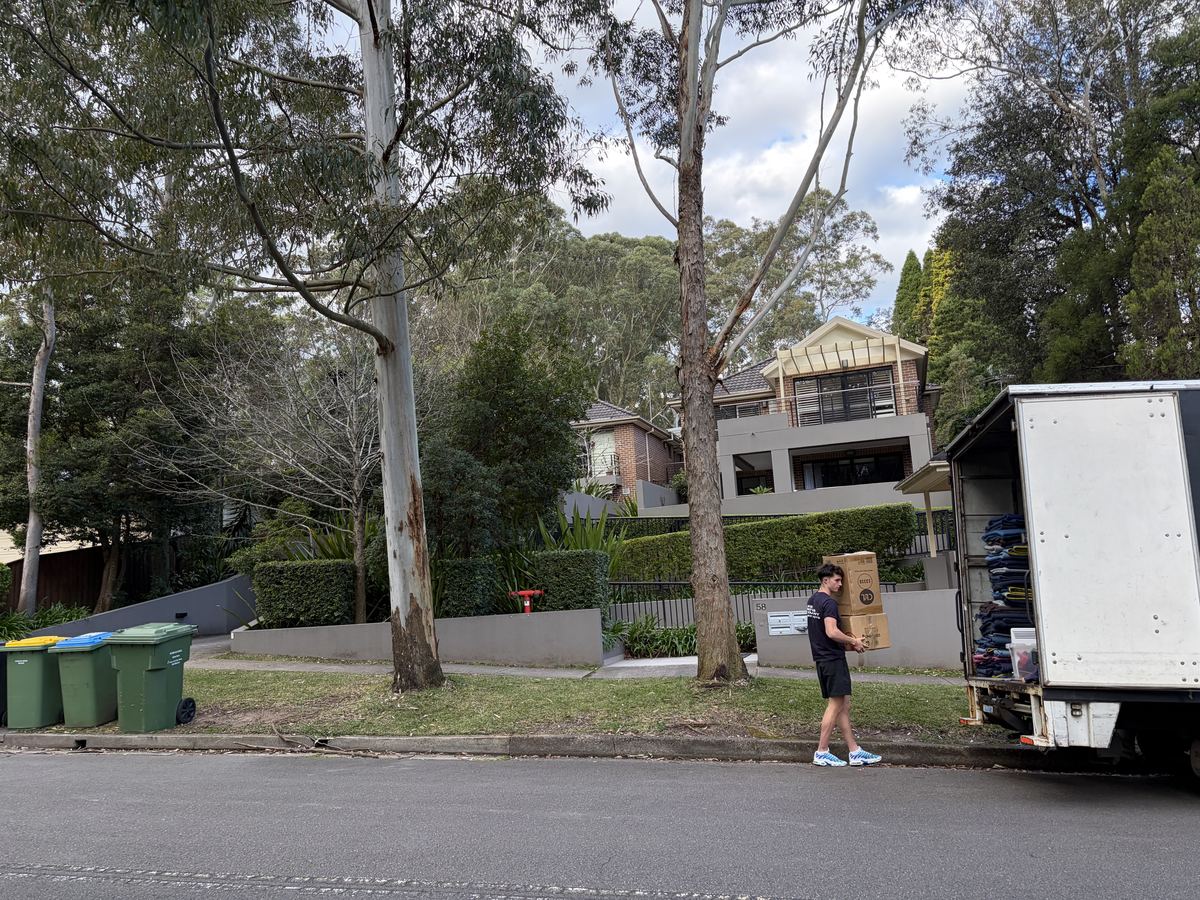Jet carrying a box outside a property in Pymble, Sydney