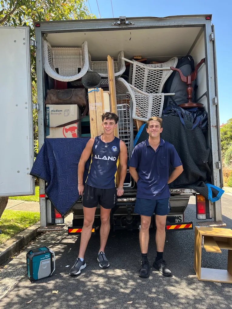 Billy and Jet from The Movers Company with a fully packed truck